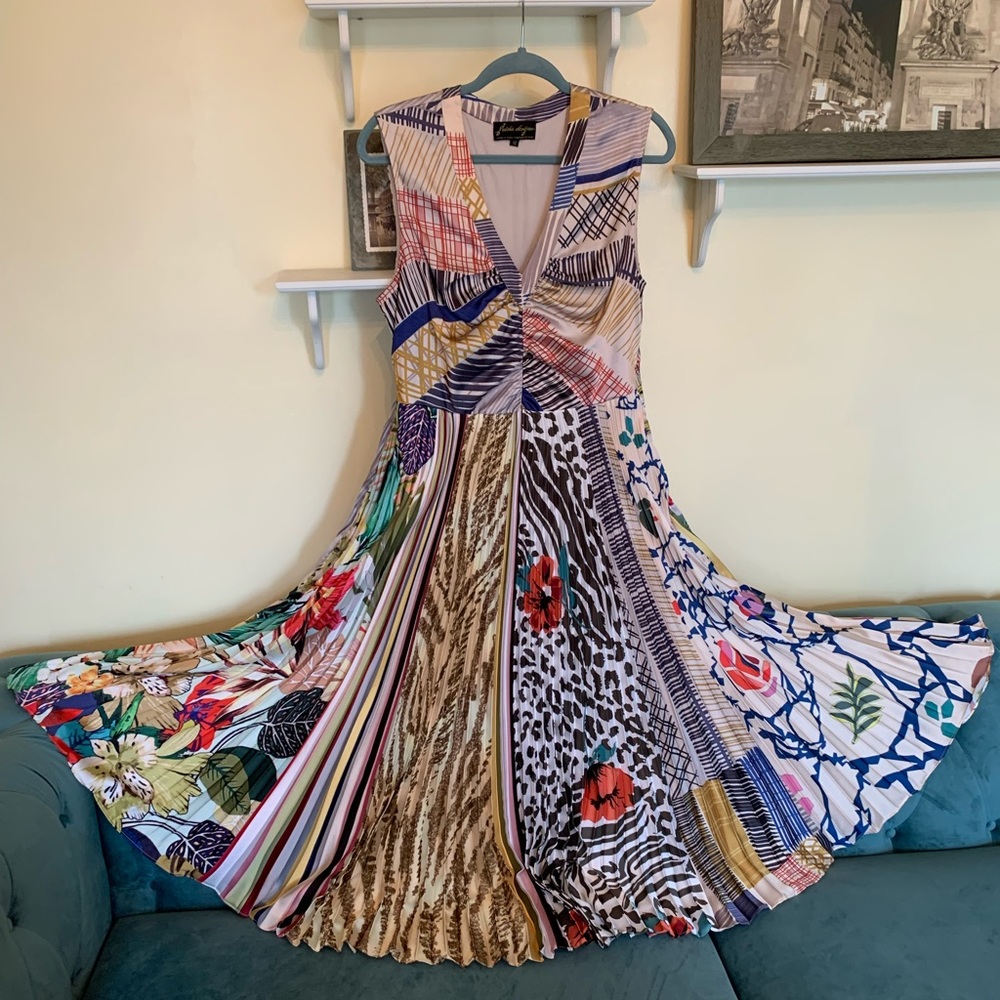 Anthropologie mixed patterned accordion dress with peep hole back.